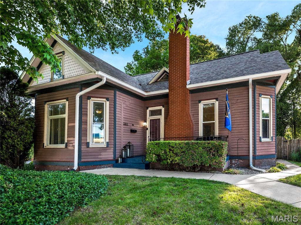 Beautiful Preservation, "award winning" historical home!! Tall ceilings, beautiful woodwork throughout, large windows to let the sunlight in, stained glass windows, the charming kitchen with pantry and built-in work station that leads to the sunroom with access to the large deck and fenced backyard!! And there's more!! Two updated baths, main floor primary bedroom,  2 bedrooms and laundry upstairs with one of the full baths. Roof new in 2017, water heater 2022, AC units 2024, upstairs flooring 2021, carpet on stairs 2021, 6" gutters 2024, and dishwasher 2024. Grab your coffee and enjoy all that Edwardsville has to offer!! Walk downtown to all the yummy restaurants, shops and festivities that are offered. Splashpad, bike trails, farmer’s market and highly anticipated Goshen Commons next to the Courthouse.