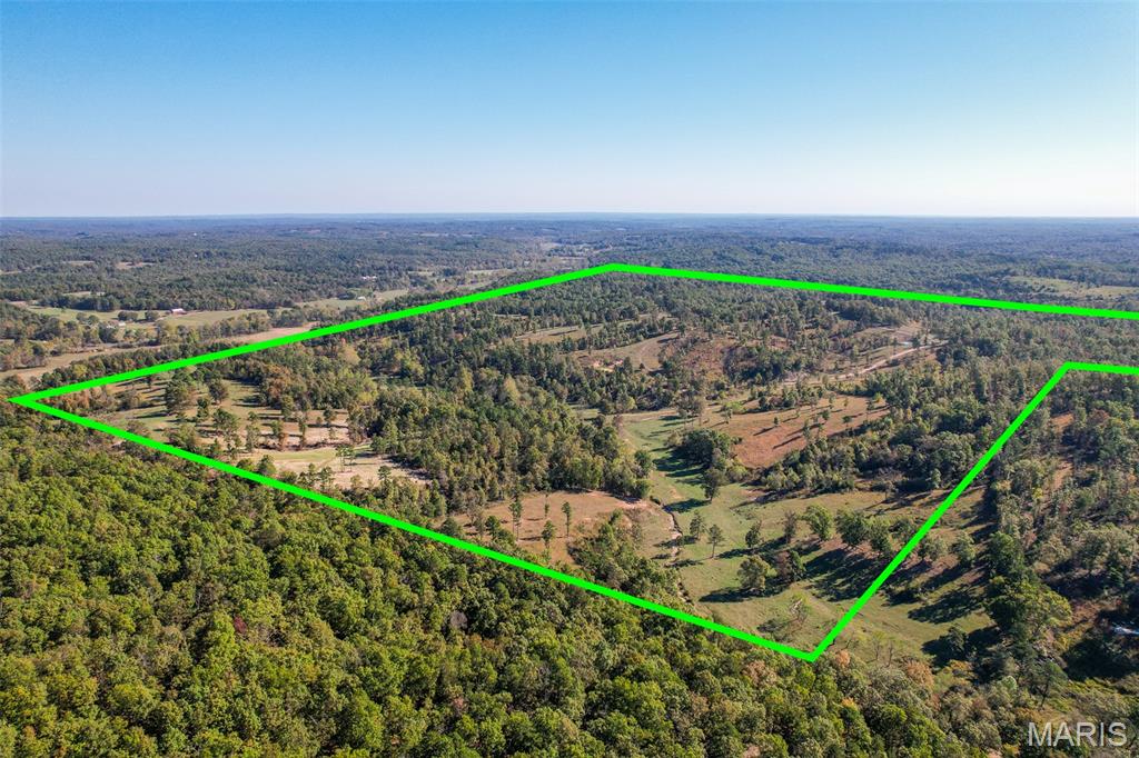 Welcome to Deer Canyon Ranch.  Located in the heart of cattle country just 3 miles outside the town of Willow Springs, Missouri, this ranch offers easy accessibility to the Hwy 60 and 63 corridors; and transport to area stockyards.  This location is great for a cattleman that wants to be close to town, but yet still able to enjoy the feeling of privacy & seclusion.  

This 279 +/- acre ranch is currently used as a cattle ranch with the added benefit of excellent hunting opportunities.  It is border fenced with a holding pen and working pen to manage cattle.  The holding pen contains multiple feed bunks and a mineral feeder which funnels though an alleyway to the working pen with squeeze chute for a rancher to safely separate and work his heard.

One of the key aspects to this property is water.  With a current spring-fed live water creek, there are three additional on-site springs that provide a good clean year-round water source for livestock.  Even in the drought of summer, the cattle never have far to travel to get a drink and there is never a concern for lack of water.  There are also several strategically located ponds throughout the property.

The current rancher runs approximately 60 head of cattle per year on the property.  Although not currently cross-fenced, the ranch certainly provides many pasture areas, so that rancher could strategically cross-fence it and set up numerous rotational grazing paddocks.

While there are no current structures on the ranch, there are certainly build site opportunities and electric accessibility running through the property for a rancher desiring to build or reside onsite.

As an added benefit, the deer hunting is exceptional as the current owner has harvested a number whitetail year over year off the ranch.  The turkey hunting potential is very good as many turkey can often be seen around the property.  And because they have not been hunted, there appears to be a large population of them.

The layout of pasture and timber with the elevation variances throughout the property present a perfect wildlife habitat.  The elevation is approximately 140 from top to bottom presenting a number of hilltops and valleys for bedding areas, in addition to easy access to the woods for cover making the deer and turkey feel safe and comfortable on this ranch.  The fresh water in and around the property also keeps the wildlife close.  

If you are a rancher looking a for a place to build or just run your heard with liver water, this might just be the place for you.