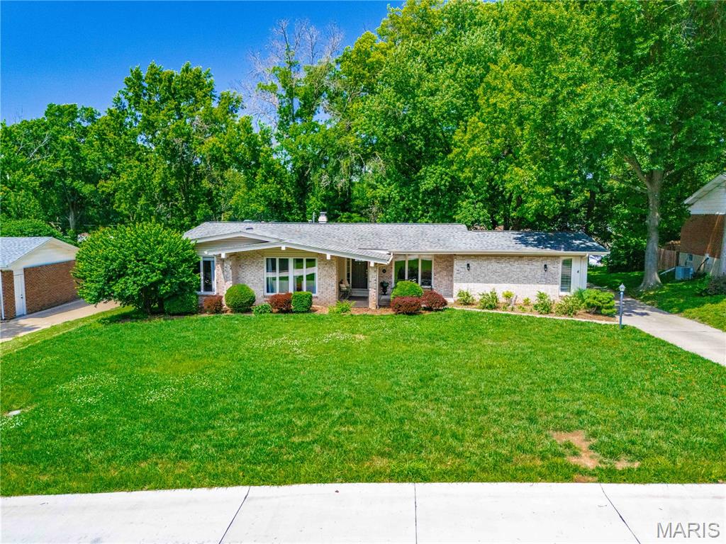 Welcome to this beautifully maintained 5-bedroom, 3 full bath ranch-style home nestled on a quiet street in the heart of Ballwin in award winning Parkway school district. Offering an ideal blend of space, comfort, and convenience, this home features hardwood and parquet flooring throughout much of the main living areas, along with separate living, dining, and family rooms that provide flexibility for both everyday living and entertaining. The updated kitchen is appointed with granite countertops, stainless steel appliances, and ample cabinetry. The spacious primary bedroom and newly remodeled primary bathroom will surely impress you. The finished lower level offers excellent additional living space, complete with a full bathroom and plenty of room for entertaining, recreation, home office, storage and work bench area. The backyard is great for outdoor dining and entertaining kids in the playhouse. The property is ideally located just minutes from parks, golf courses, shopping, grocery stores, and a wide variety of restaurants, this exceptional home offers the perfect combination of peaceful neighborhood living and easy access to everyday amenities.