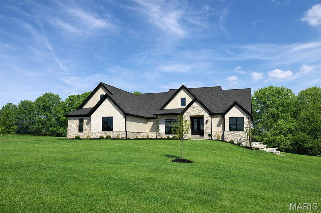 Where your vision meets flawless craftsmanship—welcome to a brand new custom home designed entirely for you! Upon entering you'll be greeted with airy colors and tons of natural light. From the living room you can step out your sixteen foot sliding glass door directly onto your 14x33 covered patio equipped with two ceiling fans ready to entertain on those late summer nights. The view of your partially wooded, private, 3.6 acre lot is beautiful! Enjoy the feeling of country living while still being in the Wentzville School District, only five minutes to highway 70, and 7 miles to Wentzville Parkway. On the main floor, you’ll find three bedrooms, highlighted by an exceptional primary suite complete with a luxurious en suite and expansive closet. The walk-out basement is partially finished adding an oversized family room area, a bedroom, an office, and a full bathroom. The opportunity to purchase a move-in-ready custom in this area is rare, schedule your showing before it's gone!
*Property is seeded and strawed. Live + showings to begin 3/28/26. Open house Sunday April 12th.