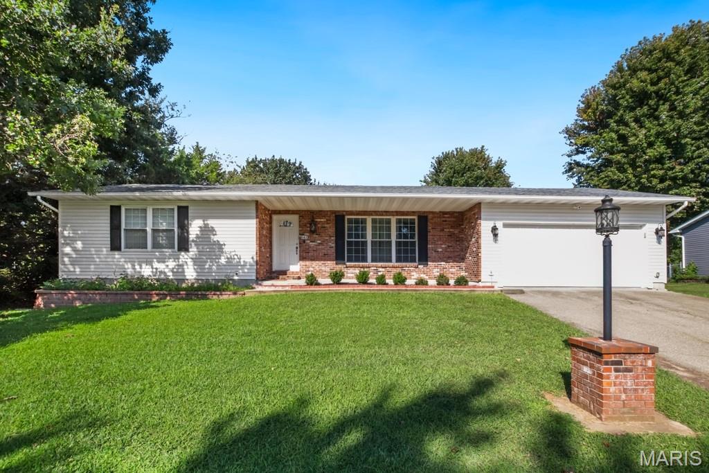 Welcome home! This very nice, well maintained 3 bedroom, 2 bath home offering comfortable living in a desirable neighborhood with great curb appeal. The primary suite features a private en-suite full bath with his and her closets, and the inviting interior boasts attractive flooring and modern appliances. Enjoy the convenience of a spacious oversized 2 car garage with paved driveway and ample cabinets already installed. The fenced back yard and patio is perfect for, pets, entertaining, or relaxing outdoors. The full basement is partially finished, offering unlimited possibilities including valuable additional living space, or additional storage space, and more. All Appliances are included, making this home truly move-in ready. This is a wonderful combination of space, style and functionality!