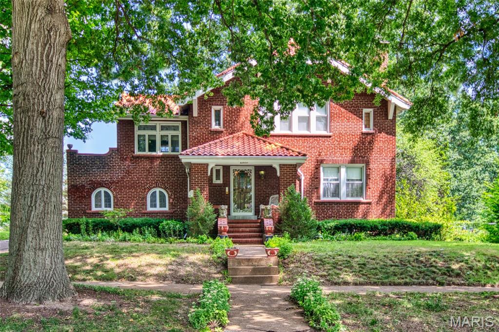 This beautiful home is being sold in current AS-IS condition. This is one of those gorgeous Bel-Nor homes just a stones throw from Normandy Golf Course and walking distance to UMSL. It has gleaming hardwood floors, arches, natural woodwork, beautiful crystal chandeliers, vitrolite tile in the eat in kitchen and all the architectural details you expect in a home of this style. Living room with fireplace. Formal dining. The upper level features a huge master bedroom and walk in closet. There are 2 other good sized bedrooms, one of which walks out to a covered porch and a art deco bath. There is also a family room with walk out porch above the 2 car rear entry garage. The basement is not finished. You will enjoy outdoor entertaining on the nicely landscaped double lot. Don't wait.