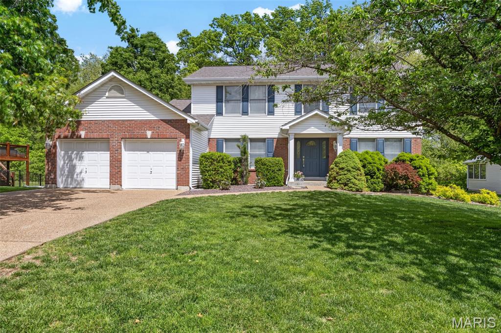 Some locations just check every box. Cul-de-sac street. Level lot. Fully fenced yard. And backing to common ground wrapped in mature trees! A backyard that feels like your own private retreat, not just a patch of grass between neighbors.  Tucked into Villages of Dardenne in the heart of O'Fallon, this well-maintained 4-bedroom, 3-bath traditional two-story delivers the updates buyers are looking for inside, matched by what's waiting outside. Impressive elevation, with partial brickwork and mature landscaping, sets the tone at the curb.

The main level features newer wood flooring in the foyer and family room, newer luxury vinyl flooring in the dining room and kitchen, and updated neutral paint throughout. The separate living room, with double glass doors, is a natural fit for a home office or playroom. The family room is anchored by a wood-burning fireplace and expansive bay windows overlooking the tree-lined yard. The wide-open kitchen features a center island, wood cabinetry, a stainless-steel gas range, updated lighting, newer tile flooring, and a planning desk, with sliding glass doors leading to a serene patio. A main-floor laundry room is conveniently located just off the kitchen and the garage!

Upstairs, the freshly painted primary suite features a walk-in closet and a luxury bath with tile flooring, separate shower, soaking tub, and double sinks. Three additional spacious bedrooms offer plenty of closet space, and the updated hall bath features newer flooring and a tub/shower combo.

Full basement with roughed-in plumbing, 2-car attached garage, and community amenities including pool, clubhouse, tennis courts, and trails. Highly rated Ft Zumwalt West schools, close to shopping, restaurants, golf, and major highways. This won't last!