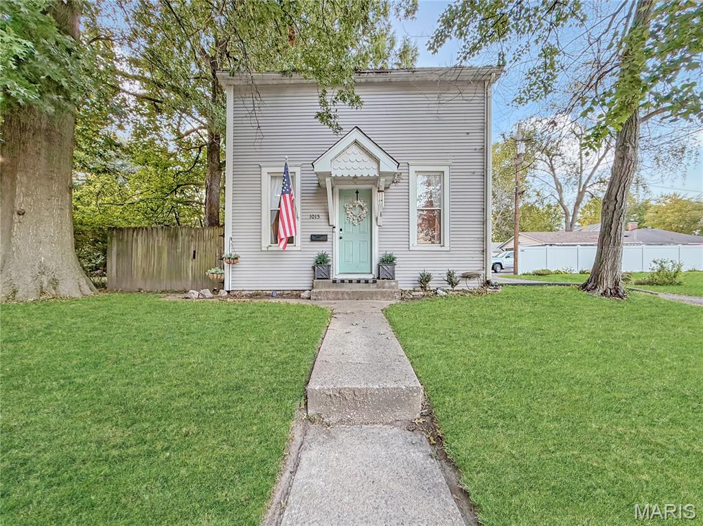 Own a piece of Belleville history! Originally built in 1887 as a carriage house, this distinctive home offers an affordable alternative to renting and is filled with natural light and historic character. The main level features a comfortable living room that opens to the dining room, a functional kitchen, a sunroom/mudroom and a convenient half bath. Upstairs you'll find the full bathroom with a walk-in shower and two tandem-style bedrooms...please note that the second bedroom is accessed through the primary bedroom. It would make a great space for a home office or craft room for those seeking a one-bedroom home, but the option remains to use it as the second bedroom as needed.

Outside, the detached garage provides enclosed parking with additional storage space. The home also features a full basement with additional storage area. The property includes two lots, offering added outdoor space and possibilities for the new owner. The additional parcel is #08-22.0-407-013, measuring approximately 41' x 48', with 2025 taxes of $255. 

Conveniently located near the MetroLink and just minutes from the restaurants, entertainment, events and historic charm of downtown Belleville, Illinois. The property is being sold as-is, however, the home appears to be in reasonably good condition. This is a unique opportunity for a first-time buyer, downsizer or investor seeking an affordable home in a convenient Belleville location. PLEASE NOTE...the lot measurements noted in the MLS description reflect the measurement of both lots combined. Combination Samsung washer/dryer is negotiable for an added price.......