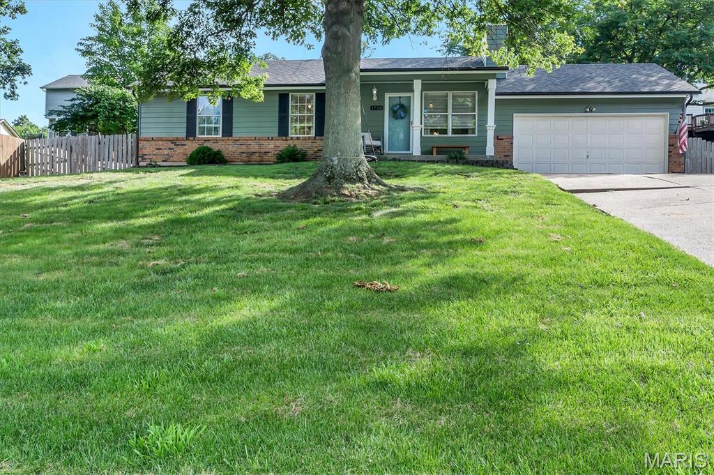 Welcome home to this beautiful 3-bedroom, 2.5-bath ranch in sought-after Bayberry Farms! The inviting floor plan features a spacious living room with a cozy wood-burning fireplace and a private primary suite complete with a walk-in closet and full bath. The finished lower level adds valuable living space with a large rec room and convenient half bath—perfect for entertaining, hobbies, or a home office. Enjoy peace of mind with a new roof installed in 2025. Outside, the fenced backyard provides space to relax, play, or garden, while the attached 2-car garage and double-wide driveway offer ample parking. Move-in ready and waiting for its next owner!