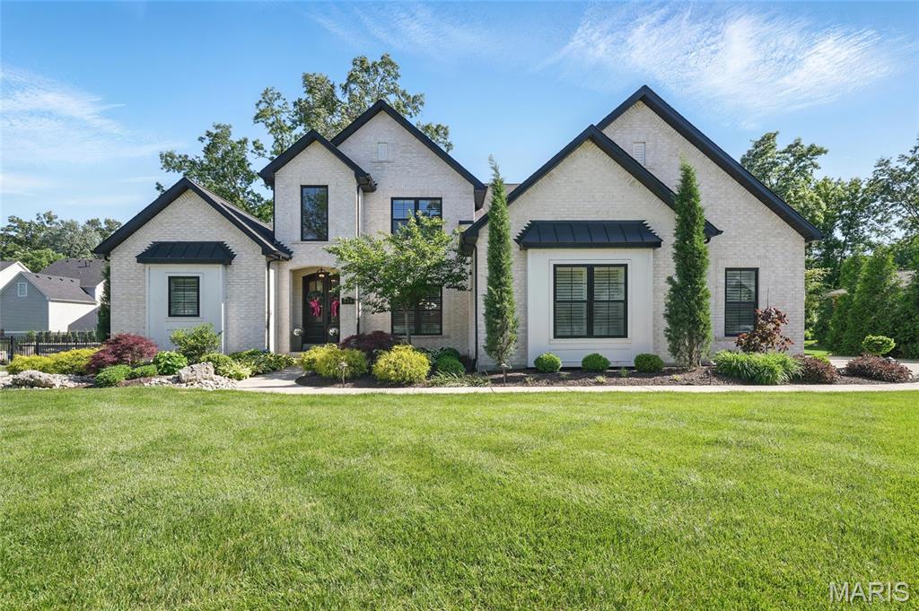 Set on an oversized lot in the heart of Kirkwood, this exceptional home pairs timeless architecture with modern construction and designer finishes.The gourmet kitchen opens to spacious living and dining areas, perfect for entertaining.The main floor primary suite offers a spa-like bath with dual vanities,soaking tub,walk-in shower and two generous walk-in closets.With four additional bedrooms,a spacious second-floor bonus room and laundry rooms on both levels,this home offers versatile living for guests,work, play, and growing families.The finished lower level features a family room,dry bar,full bath and a home gym.Outside,enjoy a private backyard oasis with a heated saltwater pool, custom outdoor kitchen,gas fire pit and a pergola-covered patio.The screened-in porch overlooks the beautifully landscaped yard—ideal for relaxing or hosting.Just a short walk to downtown shops, dining, parks,and top-rated schools,this is a rare opportunity in one of St. Louis’ most desirable neighborhoods.
