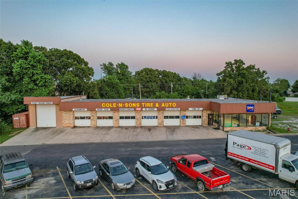 Exceptional mixed-use commercial opportunity in a high-visibility location! Right in the center of town, this property features a spacious front office with a welcoming reception area, large windows providing abundant natural light, ideal for customer-facing operations.
Next to the office, you’ll find an expansive shop area equipped with multiple service bays, high ceilings, and ample workspace to accommodate automotive, mechanical, or light industrial uses. The functional layout allows for efficient workflow and flexibility for a variety of business types.
The exterior offers convenient on-site parking and excellent accessibility for clients and deliveries alike, making it ideal for owner-users or investors. Ask your agent about the adjacent parcel for sale as well!
The property is offering a great opportunity to add value or customize it to your specific needs. Serious inquiries only - MUST VERIFY THAT BUYER IS PREAPPROVED TO SHOW PROPERTY. Don’t miss this versatile commercial property with strong visibility and potential—schedule your showing today!