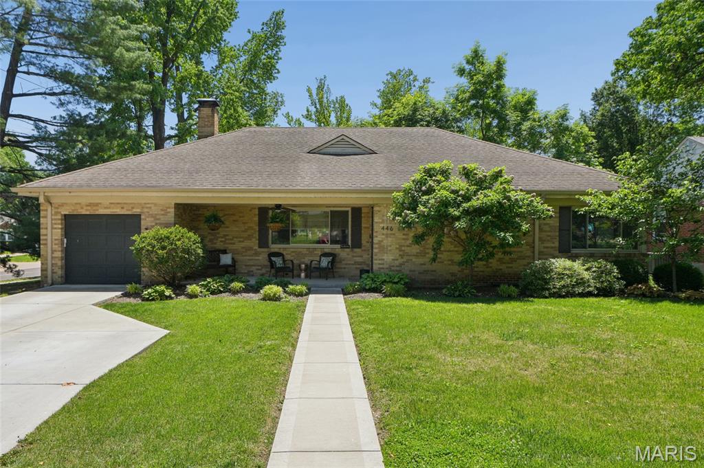 Beyond the inviting front porch, this beautifully updated Webster Groves ranch welcomes you with gleaming hardwood floors and spacious, open living areas designed for both everyday living and entertaining. The inviting living room features a large bay window, fireplace, and custom bookshelves that beautifully flank the fireplace, creating warmth and character throughout the space.
The dining room sits perfectly between the living area and kitchen, creating wonderful flow throughout the main living spaces. The updated kitchen features custom cabinetry, stainless steel appliances, open shelving, generous prep space, and a large peninsula with seating that easily becomes the gathering spot of the home.
All 3 bedrooms are located on the main floor, including a generously sized primary suite with private ensuite bath featuring double sinks and tub/shower combination — a layout feature buyers are always excited to find.
The finished lower level adds over 1,000 sqft of additional well-appointed living space and offers incredible flexibility with dedicated areas for a rec room, home office, workout space, and a 3rd full bath. Outside, the fenced backyard provides plenty of room to relax, entertain, or garden, complete with a patio and raised garden beds. With nearly 2,800 sqft of total living space, 3 full baths, attached 1-car garage, and a highly sought-after Webster location, this home offers the perfect blend of charm, style, and functionality. Conveniently located near schools, parks, and the rec center, with easy highway access and just a short drive to the popular shops and restaurants that make Webster Groves so loved.