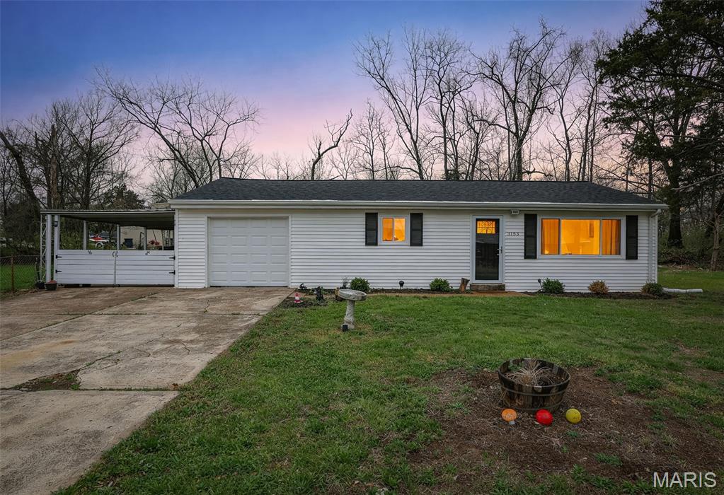 Looking for a small, quiet neighborhood where you can truly relax and feel at home? This is the one.

Set on nearly a half acre of flat, usable ground, this charming, recently updated home gives you the space to live the way you want—whether that’s planting a summer garden, hosting backyard get-togethers, or simply enjoying room to breathe.

Step inside to an open, inviting layout filled with natural light. The spacious living room flows seamlessly into the updated kitchen, featuring crisp white cabinetry, quartz countertops, and stainless steel appliances—clean, modern, and ready for everyday living or entertaining.

You’ll love the convenience of main-floor laundry, along with a one-car garage finished with an epoxy floor. There’s also a bonus carport and partial fencing already in place—perfect for pets or added flexibility.

Major updates offer peace of mind, including a newer roof, siding, electric panel and a brand-new septic system.

Tucked away in a peaceful setting, yet just 15 minutes from major shopping, dining, and entertainment—this home truly gives you the best of both worlds.

Come see it in person… you’ll feel it the moment you pull in.