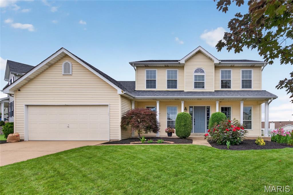 Feel like you are on vacation every day in this 2,022 sq ft, 2-story home in the desirable Patriots Landing neighborhood!  This well-maintained home has 3 bedrooms, 2 .5 bathrooms, an updated, on-trend Kitchen and a gorgeous paver patio overlooking the level back yard with an inground pool.   The curb appeal is inviting with a large front porch, architectural shingles, vinyl siding, enclosed fascia/soffits, tasteful landscaping and lawn irrigation.  The backyard is fenced, has a huge paver patio, landscaping, a hard top gazebo with curtains and a generous sized in-ground pool for endless summer fun.  Interior features include wood flooring throughout the main floor and second floor hallway, an updated Kitchen, quartz countertops, breakfast bar, 42 inch shaker style white cabinets with hardware, soft close feature, roll out shelving, cabinet pantry, composite sink, subway tile backsplash, black stainless steel appliances,  chimney style range hood, gas range, dishwasher, refrigerator, woodburning fireplace with new gas insert in the Family Room, Office/Living Room with glass French doors, Dining Room, main floor laundry and more.  The upstairs has 2 secondary bedrooms and the Primary Suite with two closets (one is a walk in) and a luxury Primary Bath with Onyx tile floors, double bowl vanity with wave bowls, touch control mirror, soaking tub, working window and a tile shower.  Additional features include a video doorbell, water softener, humidifier and a Kitchen remodel in 2021.  The rear windows have been replaced (2017) and the front windows are newer (2023).  The back yard is level and has plenty of grass for a play area in addition to the inground pool and pool decking (decking replaced in 2018).  This amazing location is near schools, shopping, recreation, restaurants and everyday conveniences.  There are two neighborhood lakes.  Students will attend desirable Fort Zumwalt schools.  Amazing home with so much to love!