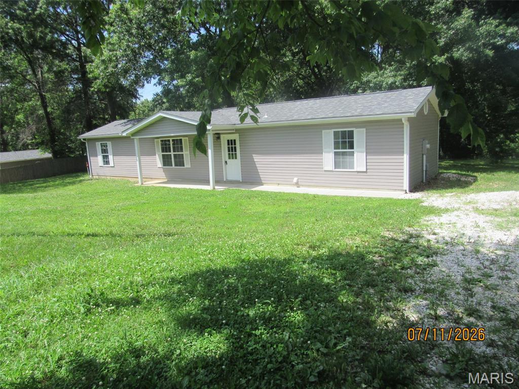 Almost new (2023) home on 1.53 acres sitting towards the end of the road. Nice level lot wooded and open, with several mature trees for a nice shade in the back yard, and nice open front yard. 2 bed,1 on each end for privacy, 1 bath and open kitchen, dining and  great! And NO stairs. Enough room to build a nice outbuilding.  A lot here for the money!
