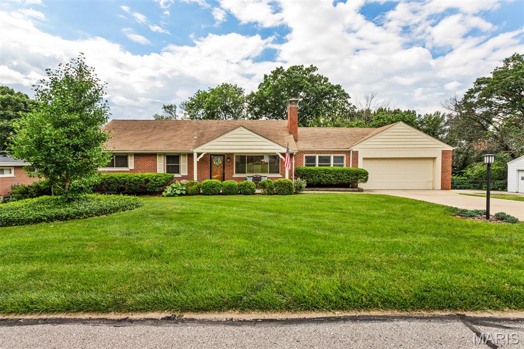 Finally. A home that fits the life you actually live. Not the life on paper — the real one. Mornings in a sunny breakfast room, fall evenings by the fire, friends and family with room to spread out, a backyard ready for whatever you dream up. Most buyers search a long time for this in Des Peres. You won't have to. This 1.5-story home offers 2,724 sq ft across three finished levels, including a walk-out, partially finished lower level. The main-floor primary suite features dual vanities and two closets. Throughout, you'll find two wood-burning fireplaces, a center-island kitchen, a wood-paneled den, and a family room opening to the oversized deck. The walk-out lower level adds a second family room, 4th sleeping room, and 3rd full bath. Outside: a flat, fenced, pool-ready half-acre — genuinely rare here. Kirkwood Schools, minutes to I-270, Manchester Rd, multiple medical centers and easy access to Hwy 40.  Make your appointment today.