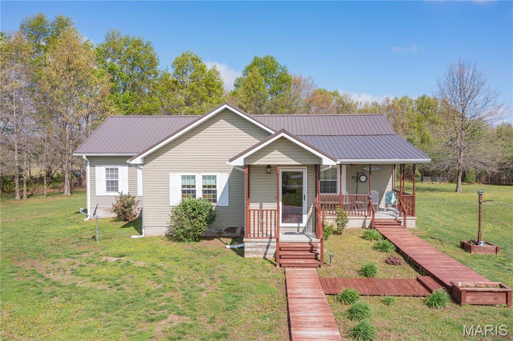 Dreaming of your own slice of country paradise? This meticulously maintained home on 3 acres offers the perfect blend of comfort, space, and peaceful surroundings. The beautifully landscaped yard sets the tone, while inside you’ll find a large living room filled with natural light and an open-concept kitchen, dining, and living area—ideal for everyday living and entertaining. Kitchen appliances are included, and select areas feature hardwood flooring.

The roof is approximately 9 years old, and the property also includes a 2-car garage/pole shed with abundant storage, including a loft space. Outside, there’s plenty of room for a small hobby farm, gardens, or outdoor activities, along with multiple exterior water spigots for convenient watering and underground gutters for added functionality.

A small finished shed—currently used as a tack room—offers versatile space for a garden shed, workshop, or personal retreat. Enjoy quiet mornings on the front porch watching deer pass by, or unwind on the back deck taking in the peaceful views.

Estimated taxes with home owners exemptions $2,533. 50

Call to schedule or viewing today! 

Agent is related to the seller. Seller is accepting offers through April 29th @ noon .