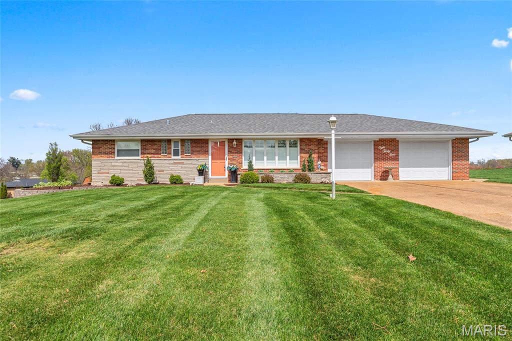 Welcome home to 839 Meadow Acres Lane.  This open and bright home is just waiting for it's next residents.  The amazing separate dining room leads into the kitchen that features custom countertops, plenty of cabinet space, a separate breakfast bar, and matching appliances (Refrigerators included).  On the main level there are three bedrooms, a comfortable living room with fireplace and a sun filled family room overlooking large back yard.    The oversized double garage is large enough for three cars or a handyman's workshop.  The basement is large and partially finished, waiting for you to put your own touches.  There is a full bathroom in the basement as well.  The outside of this home is the show stopper.  Large well kept yard, beautiful landscaping and you can enjoy some time in the custom built gazebo in the back yard.   Come see this home soon because it won't last.