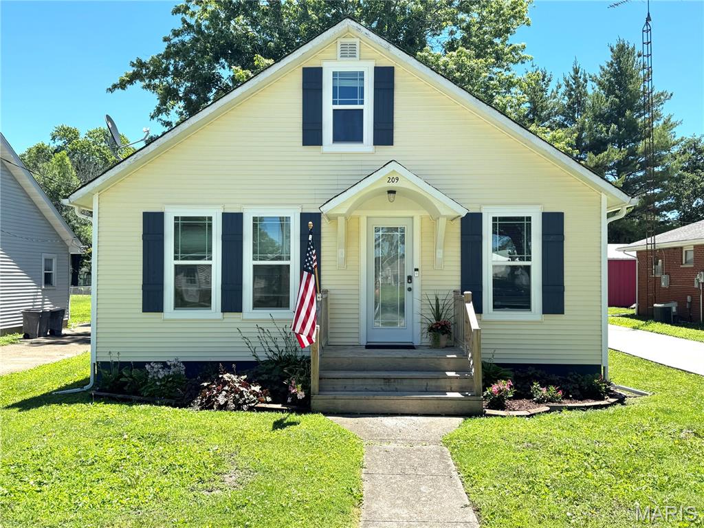 Cute as a button and affordable home!! This one would be perfect for first time buyers, those just starting out, or anyone looking to downsize! This cutie offers a functional layout with a main level bedroom, full bath, and convenient main floor laundry. Upstairs, you'll find an additional bedroom and a half bath, providing flexible living space. The home features a separate dining area off the kitchen, creating a comfortable setting for everyday meals and gatherings. Situated on a crawlspace, the property also boasts a nice yard and a covered back porch, ideal for relaxing outdoors. A newly constructed 2 car garage and new concrete driveway add excellent value and convenience. Don't miss this opportunity to own a well maintained home at a reasonable price! Schedule your showing today :)