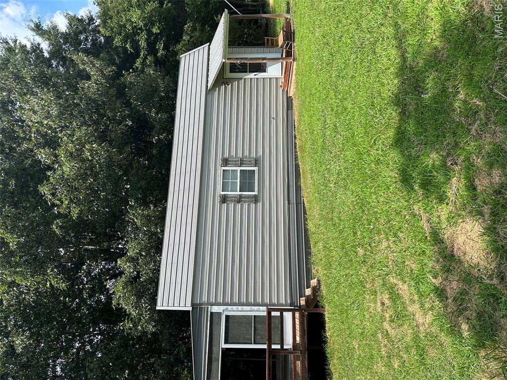Looking for a small converted tiny house with access to a private boat ramp on Current River? Here is a very efficient small cabin, with 435 sq ft on the bottom floor and even more potential living area in the upper loft. This cabin comes furnished and is ideal for the weekend getaways or with just a few touches, could be used as an AirBnB. The cabin has a screened sunroom on the back and a small storage building. Property has county water, 1,000 gal septic, phone, and electric. This is a very desirable location and your own personal key to the boat ramp. Better hurry as this will not last long.