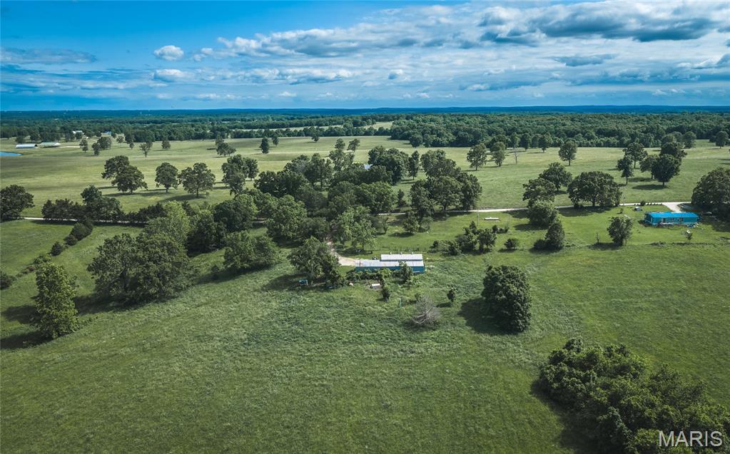 59.84 m/l acres of mostly open pasture with some woods offering a good setup for livestock, hay production, or a future homesite. The property includes a large pole barn, two wells, an existing lagoon, and cross fencing already in place.
A natural spring provides a dependable water source for livestock, and the open ground allows for easy use and management. Great potential building locations are available with water and sewer available on site.
Whether you're looking to run a cattle operation, start a small farm, or build a home, this property offers a solid combination of usable acreage and existing improvements.