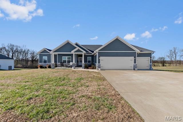 Welcome to modern comfort wrapped in timeless Craftsman charm! This stunning 4+ bedroom, 3-bath ranch was built in 2020 and sits on a spacious .56-acre lot in the highly desired Enclave Lake Estates, offering the perfect blend of peaceful living and convenient location between Cape Girardeau and Jackson.  Step inside to an inviting open floor plan with 2,000 sq ft on the main level plus a full finished basement, giving you all the room you need for everyday living and unforgettable entertaining. The large living area flows seamlessly into a beautiful kitchen featuring custom cabinetry, sleek countertops, and a massive walk-in pantry complete with built-in cabinets and extensive shelving.  Downstairs, you’ll find a spacious family room/game room, ideal for movie nights, arcade battles, or your own personal hangout spot. This home has storage covered with both an oversized 3-car garage and a John Deere room/garage in the basement.  Enjoy four+ bedrooms, three full baths, and a layout that gives everyone plenty of room to spread out. The outdoor space is equally impressive with plenty of yard for pets, play, or future backyard dreams.   Located in Jackson School District, this home checks every box—style, space, storage, and a fantastic neighborhood.