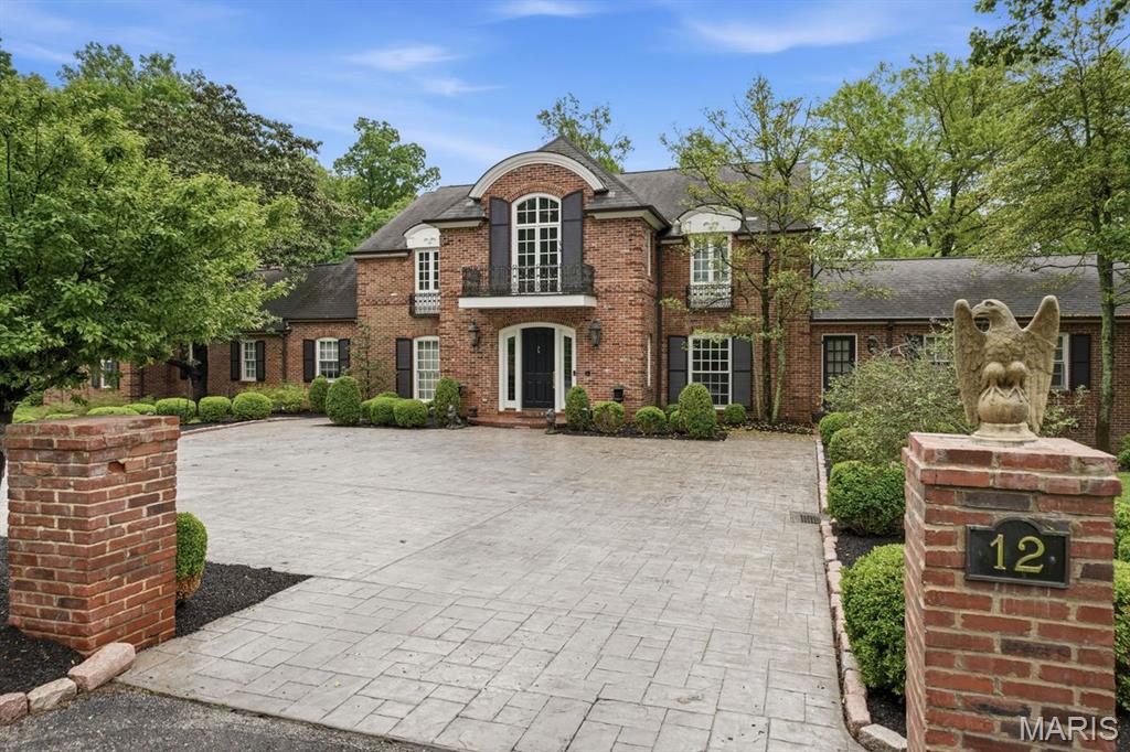 Set gracefully on an idyllic 1.4-acre parcel in the heart of Ladue, 12 Glenview Road offers a rare blend of privacy, prestige, and proximity. Framed by mature trees and expansive, park-like grounds, this distinguished estate captures the essence of refined suburban living while remaining moments from the region’s most coveted amenities.

The main residence features five well-appointed bedrooms. A separate pool house adds a sixth bedroom, offering ideal accommodations for guests, extended stays, or a private retreat. Outdoors, a resort-style pool anchors the grounds, creating a setting that feels both luxurious and effortless, perfect for summer gatherings or quiet relaxation.

This property delivers a lifestyle defined by ease and access, just minutes to the boutiques and dining of Clayton, the cultural and academic energy of Washington University, and the world-class recreation of Forest Park. Whether mornings begin with a quiet walk along tree-lined streets or evenings unfold poolside with effortless entertaining, this setting offers a sense of retreat without compromise.

A truly exceptional opportunity to own a legacy property where land, lifestyle, and luxury converge.