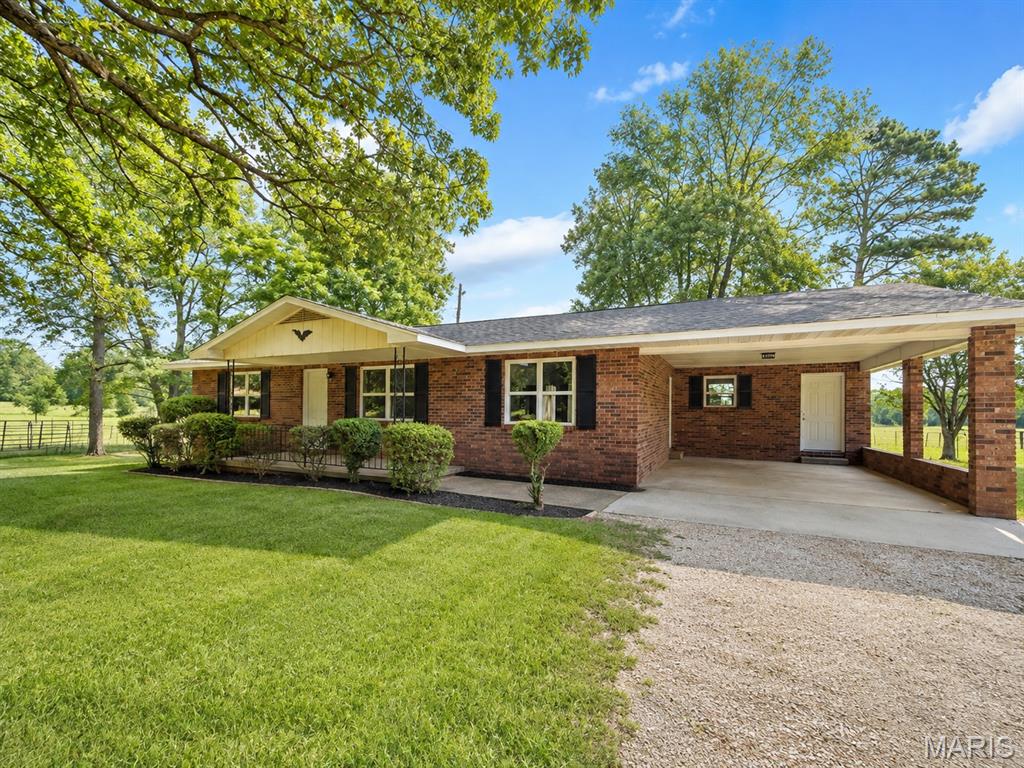 Just outside of Grandin, this all-brick 3-bedroom, 2-bath home sits on approximately 10 acres and offers a great opportunity for a mini farm! Currently used for cattle, the property includes a barn, pond and is situated on a corner lot. The home features a new roof, new windows, and new heating and air, plus a spacious living room, kitchen with bar area, dining room, and large laundry/storage room. Appliances include the refrigerator, dishwasher, electric range, and microhood. A sliding door leads to the patio overlooking the property, and there is also a one-car carport. If you've been looking for acreage, room for animals, and country living just outside of Grandin, this one is worth a look!