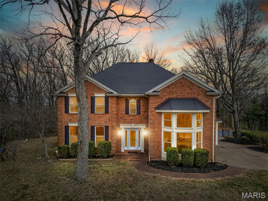 One time showing. Perched high on a hill overlooking 65 breathtaking acres, this stately two-story brick home offers sweeping views and a peaceful country setting. The main level features a spacious kitchen that connects to a bright breakfast room, perfect for casual dining while taking in the surrounding scenery. The impressive great room showcases tall ceilings and floor-to-ceiling windows that fill the home with natural light.  A formal dining area is ideal for hosting gatherings and special occasions.
The upper level includes the 3 bedrooms along with a conveniently located laundry room for added functionality. The lower level offers even more room to entertain and unwind with a bar area and a cozy family room, creating the perfect spot for guests or relaxed evenings at home.

Set on 65 acres with a commanding hilltop setting, this property offers space, privacy, and incredible views in every direction.