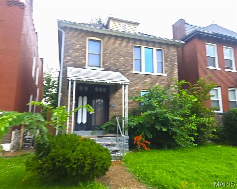 This spacious 3-bedroom brick home presents an excellent opportunity for homeowners and investors alike. Full of character and potential, it's ready for the right owner to restore its charm and make it shine once again.

Inside, you'll find tall ceilings, a classic staircase with original wood treads, and generously sized rooms that showcase the home's historic appeal. The main level features a welcoming living and dining area that flows into the kitchen, creating a functional layout for everyday living. Upstairs offers three comfortable bedrooms and a full bathroom, providing ample space for family, guests, or a home office.

Step outside to enjoy the large backyard—a valuable feature that offers plenty of room for outdoor entertaining, gardening, or future improvements.

Conveniently located near O'Fallon Park, major roadways, and neighborhood amenities, this property offers outstanding potential for both owner-occupants and investors. Property is being sold AS-IS. Seller will make no repairs and will not provide any inspections.