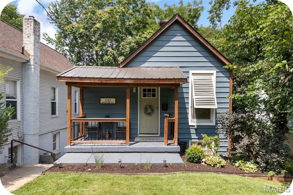 Welcome to this adorable, fully updated bungalow in the highly sought-after Dogtown neighborhood, just minutes from Forest Park, the Saint Louis Zoo, Art Museum, Washington University, and Barnes-Jewish Hospital. This charming two bedroom, one bath home features a unique and functional floor plan, with the kitchen and living room on the lower level offering easy walk-out access to the spacious backyard. The main level includes two bright, comfortable bedrooms and an updated full bath. Filled with natural light, the home offers a cheerful atmosphere, a large fenced backyard perfect for entertaining or relaxing, and convenient off-street parking. A brand new roof installed in 2025 adds even value and peace of mind. Whether you're a first-time homebuyer looking for a move-in ready home in an unbeatable location or an investor seeking an excellent addition to your short-term rental portfolio, this Dogtown gem is one you won't want to miss!