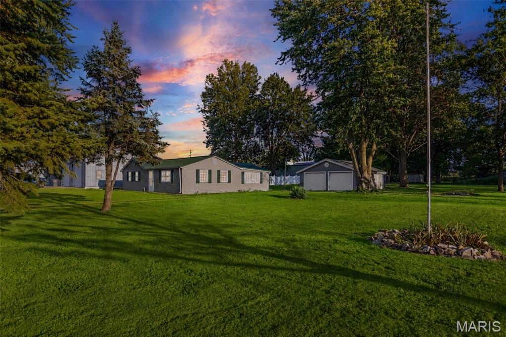 Bring your vision and make this property your own! Situated on approximately 1 acre on the outskirts of Jerseyville, this 3-bedroom, 1-bath fixer-upper offers all-one-level living and plenty of potential. The primary bedroom features French doors leading directly outside, and the home's layout offers potential for the addition of a second bathroom. A metal roof is already in place, and outside you'll find a 2-car detached garage with workshop space and a dog kennel. The large, level corner lot provides plenty of room for outdoor living, a future garden, or simply enjoying the open space and views of the surrounding farmland. Conveniently located just outside of town while offering a more peaceful country feel, this property is ready for someone to bring their ideas and make it shine. Property is being sold AS-IS.