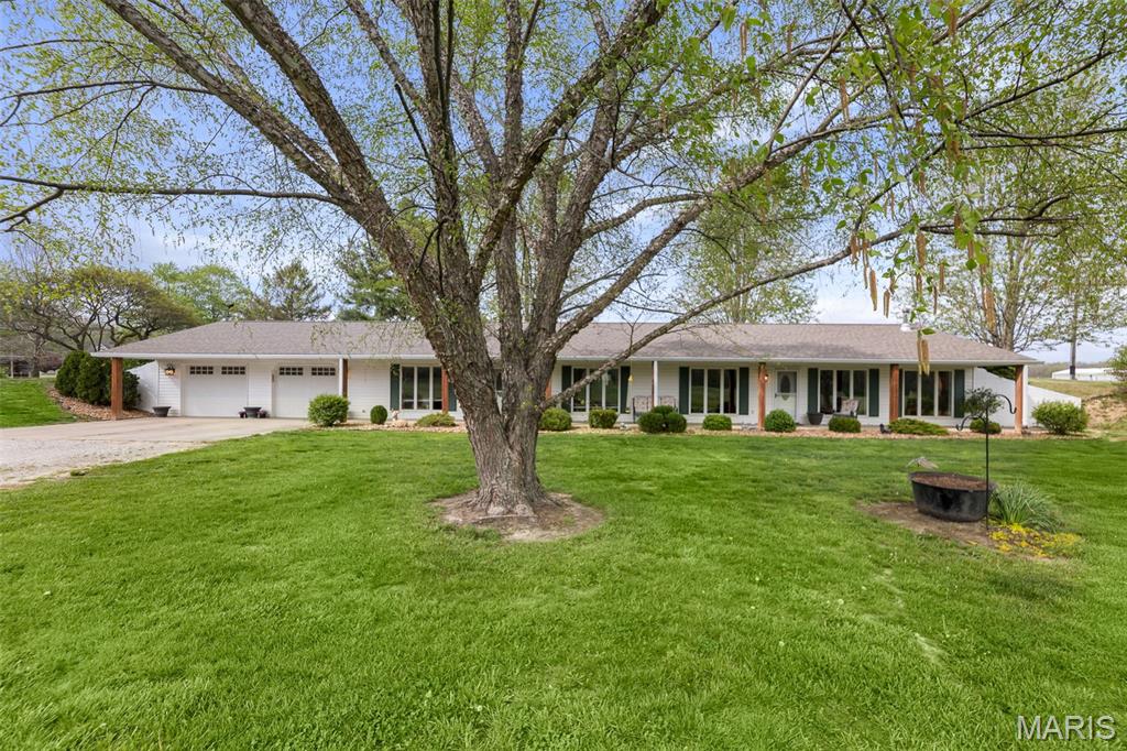 Willow Creek Stables could be yours!  This lovely home offers lots of living space in well maintained condition.  Spacious family room leads to a large open kitchen and dining area.  There's a flex room off the living room that would make the perfect office, reading area or gaming cove.  The split bedroom floor plan includes a large primary suite with a huge walk-in closet, private bath area, vanity, storage shelves and skylight.  The secondary bedrooms are nicely sized with deep closets and close to an additional bathroom off the hall.  The beautiful neutral colors throughout will allow you to decorate to your style and make it feel like home.  The large covered porch running along the front of the home is warm and inviting and perfect for those after dinner conversations and family time.  The attached garage holds two vehicles generously and still has lots of room for storage.  This beautiful ranch earth home sits on a 7.50 acre property which includes a large well-maintained 12 stall barn with a nice tack room and extra storage.  There is also a lean-too that offers coverage for lawn equipment, supplies, a boat or RV storage.  There is a small coral off the stable and then a larger fenced area for the horses to run free and enjoy the sunshine and fresh air.  The home and barn are both supplied with 200 amp electrical service and both the home and barn utilize the the well located on the property.  The above ground pool is excluded from the sale, but is negotiable within an offer.  The Seller will need some time to relocate the current horses onsite, but may consider leaving them with the right Buyer and offer.  The Seller will also need to secure adequate housing prior to closing.