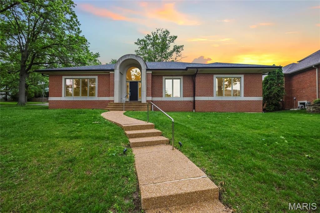 Experience the prestige of Clayton Gardens in this exceptional contemporary ranch, gracefully positioned on a prominent corner lot in one of Clayton’s most sought-after settings. With over 4,100 square feet including the finished lower level, this distinguished residence offers an impressive blend of timeless scale, comfort, and thoughtful updates. Four generously sized bedrooms, elegant architectural arches, and expansive living spaces create an atmosphere that is both refined and inviting from the moment you enter.

The gracious floor plan flows beautifully from the entry into the formal and casual living areas, while the dining room is enhanced by a distinctive granite table and shelf that remain with the home, adding both character and functionality. The spacious primary suite is a true private retreat, featuring a new luxury walk-in tub with water jets, air jets, color lighting, and aroma therapy features for a spa-inspired experience at home.

This residence has also been carefully improved with accessibility in mind, offering a rare combination of elegance and convenience, including a brand-new elevator to the lower level, a handicap-accessible garage ramp, and the beautifully appointed walk-in tub.

Additional recent upgrades include a new wall oven, built-in microwave, and updated lighting. The lower level adds versatility with a bathroom and a room previously designed as a wine cellar, which could easily be restored for the next owner’s collection. The garage is further enhanced with electric service for an EV charger.

A rare offering in the heart of Clayton Gardens, this is a home of comfort, stature, and lasting appeal. Schedule your showing today!