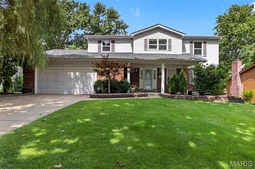 Welcome home to this spacious 2-story nestled in a desirable location! The large yet cozy family room features a wood-burning fireplace and offers excellent flow for both everyday living and entertaining. The kitchen boasts custom wood cabinetry, granite countertops, and a breakfast bar that opens seamlessly to the family room. Formal living and dining rooms provide plenty of space for hosting family gatherings and special occasions.

Upstairs, you'll find four generously sized bedrooms and two beautifully updated full bathrooms with granite-topped vanities. The partially finished walk-out lower level is an entertainer's dream, featuring a rec/game room with a built-in wet bar and kitchenette, a full bathroom, media room, and surround sound system.

Step outside to your private backyard retreat with a large composite deck overlooking a heated saltwater fiberglass inground pool, spacious patio, wooded backdrop, and adjoining walking trail. Additional features include hardwood floors, tilt-in windows, main-floor laundry, and an attached 2-car garage.

As an added bonus, the seller is offering an $8,000 credit at closing, giving buyers the opportunity to personalize select finishes and make this home their own while enjoying immediate value! It's the perfect chance to add your personal touch and create the home you've always envisioned.

Conveniently located near shopping, dining, parks, and highly acclaimed Lafayette schools in the Rockwood School District, this home offers the perfect combination of comfort, space, and outdoor enjoyment. Welcome home!!