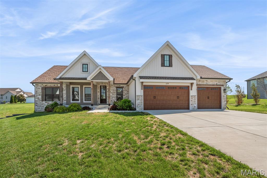 Immaculate move-in ready home in Westborough Estates situated on a cul-de-sac with an attached oversize 3 car garage. This home features 3 bedrooms, 2.5 bathrooms offering 2025 sq ft of luxury living space. You are first welcomed to the large covered front porch surrounded by eye-catching landscaping. Step into the entry foyer that has an office/den just to your right with a built-in desk and picture window. Living room is the beginning of an open floor plan with high ceilings, gorgeous gas fireplace and surrounding windows bringing in tons of natural light. The kitchen is complete with beautiful custom cabinets, granite countertops, tiled backsplash, stainless steel appliances, farmhouse style sink and center island with breakfast bar. Dining area boasts beautiful lighting and doors leading to the backyard. Right off the kitchen is a mud room with pantry and convenient half bathroom. Enjoy a little reading nook that leads you back to the massive master bedroom suite that exhibits tray ceilings with faux wood beams. Master bathroom has 2 separate oversized vanities, large walk-in ceramic tile shower and a walk-in closet. There are two additional nicely sized bedrooms with large closets and another full-size bathroom with an oversized vanity and tub/shower combo. Laundry is located on the main level for added ease. The basement is unfinished and ready for your personal touches offering tons of space perfect for a family room, recreational area or personal gym. Enjoy the large covered back patio and level backyard perfect for entertaining guests or relaxing on a beautiful day. Be sure to make your appointment today to come see everything this beautiful home has to offer!