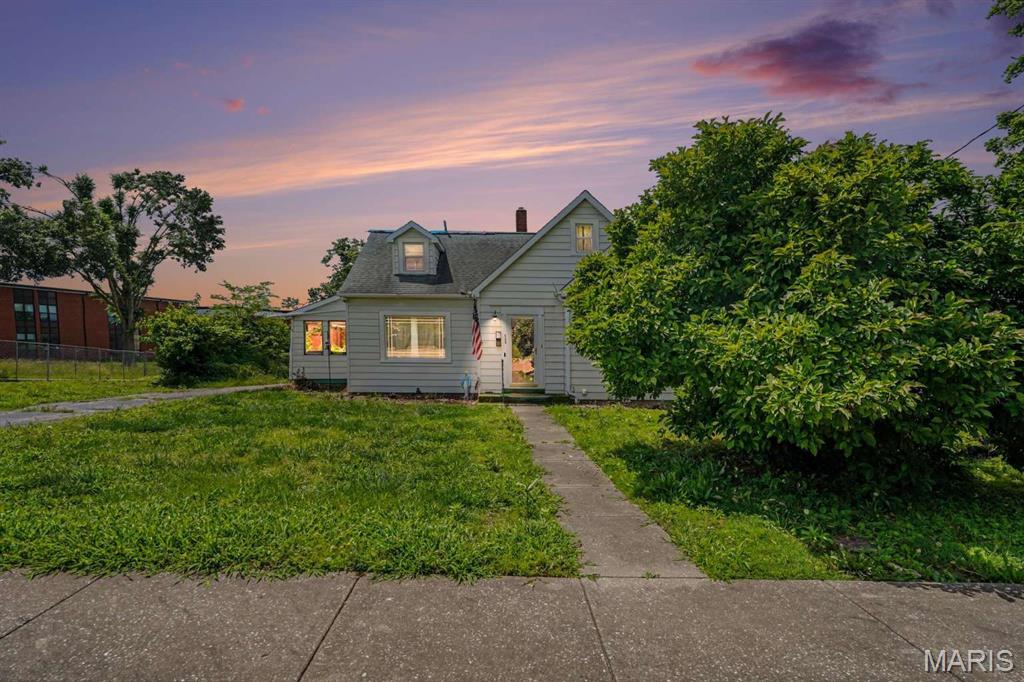 This 3 bedroom/1.5 bath home offering 1,763 sq ft. The kitchen features wooden cabinets, laminate countertops, and tile flooring. The living room includes a fireplace, hardwood flooring with carpet overlay. Bedrooms feature wood flooring, with one carpeted room, and all bedrooms include custom cabinets for added storage basement includes a dedicated laundry area and additional unfinished space for storage or future use.

Outside, the property features a wide backyard with plenty of usable outdoor space. The home has central heating and air, with the system serviced this year. Roof was replaced approximately 5 years ago but sustained tornado damage and will need repairs or replacement, with missing shingles and tarp currently in place. Property is being sold as-is, presenting a solid opportunity for buyers looking to renovate, customize, or add long-term value.