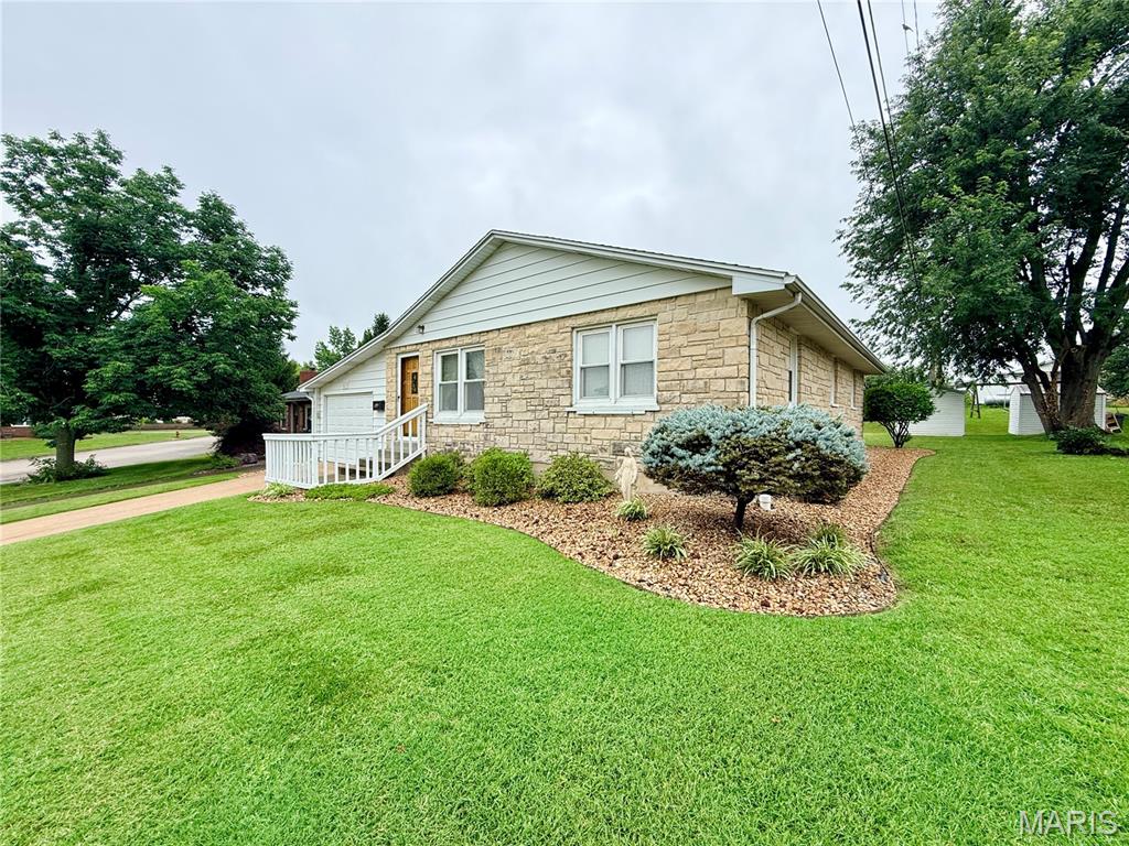 Charming, move-in ready, and located in one of Perryville's most desirable neighborhoods!  This lovingly maintained 3-bedroom, 1-bath home offers 1,064 square feet of comfortable living space and is ready for its next chapter.  Built in 1958, this home showcases the pride of ownership that only years of attentive care can provide.  Step inside to a welcoming living room highlighted by a beautiful stone gas fireplace-the perfect focal point for cozy evenings at home.  The bright eat-in kitchen offers an abundance of oak cabinetry, ample workspace, and includes all appliances, making meal preparation a breeze.  The cheerful bathroom features a convenient laundry chute, adding a thoughtful touch to everyday living.  The full basement provides excellent storage and endless possibilities for the future expansion with a rough-in already in place for a second bathroom. Whether you're dreaming of a family room, hobby space, or additional living area, you'll appreciate the flexibility this lower level provides.  Outside, you'll find an attached one-car garage, a beautifully landscaped and meticulously manicured yard, a rear patio perfect for relaxing or entertaining, and a handy storage shed to keep lawn equipment tucked away while maximizing garage space.  Location truly sets this home apart!  Situated just moments from the city park and public school, this is a neighborhood buyers are always eager to call home.  This charming property offers exceptional value and is sure to attract plenty of attention.  Don't wait-homes in this location and price range don't stay on the market long!