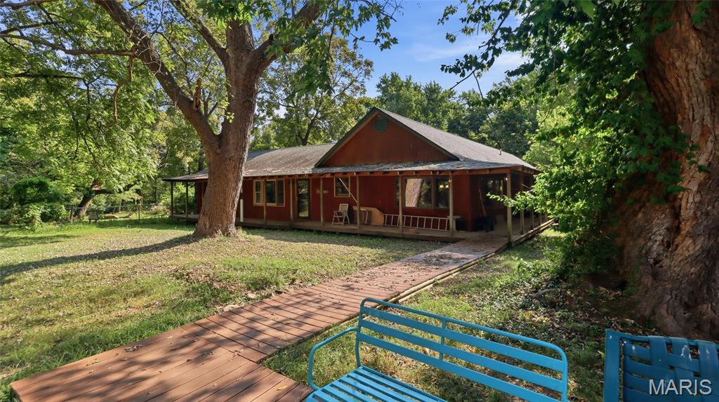 Some properties give buyers space. This one gives them a reason to stop searching. Set on 5 acres between Lebanon and Waynesville, this 3-bedroom, 2-bath home offers approx. 2,880 sq ft with privacy, flexibility, and room for real life near Fort Leonard Wood and Lebanon. Multiple living areas, flexible spaces, and a comfortable layout make it easy to gather, work from home, host guests, or simply spread out. Large front and back porches invite slow mornings, quiet evenings, and the kind of breathing room that makes home feel different. Inside, you’ll find comfortable living spaces, a functional kitchen, and room to make the home fit your lifestyle. Outside, the fenced backyard adds usable space, while the large shop with a 13’ door, office area, and storage gives you the setup buyers are always asking for but seldom find at this price. Private, practical, and still convenient to Fort Leonard Wood, Lebanon, I-44, and everyday needs, this one checks the boxes without feeling ordinary. And there is one extra feature that makes this property even more versatile, call to ask before you schedule your showing.