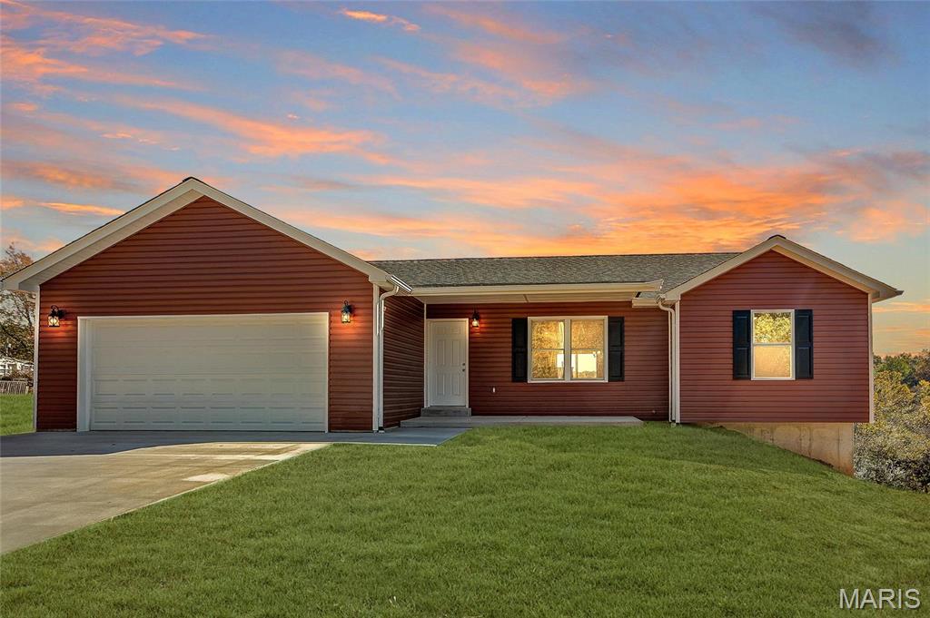 Welcome to this well-maintained second-tier lake home in the gated Lake Timberline community in Bonne Terre, Missouri, offering stunning first-tier lake views and access to a private, amenity-rich lake lifestyle. This 3-bedroom, 2-bath home combines comfort, functionality, and scenic surroundings, making it ideal for full-time living, a weekend retreat, or a secondary home near the lake.

Inside, the home features vaulted ceilings in the kitchen and living room, creating an open, airy layout filled with natural light. The main living space is designed for both everyday living and entertaining, with a seamless flow between the kitchen, dining, and living areas. Large windows and the sliding glass door enhance the sense of space while capturing the natural beauty of the surrounding community.

The primary living areas are positioned to maximize comfort and usability, while all three bedrooms offer practical space for family, guests, or a home office setup. Two full bathrooms provide convenience and flexibility for a variety of living arrangements.

Step outside to the 12x12 covered deck complete with a ceiling fan, creating an inviting outdoor living space that can be enjoyed throughout the seasons. Whether you're having your morning coffee, hosting guests, or unwinding in the evening, this space is designed to take full advantage of the peaceful setting and lake views.

Located within the gated Lake Timberline Community, this property includes access to 12 private lakes, offering opportunities for boating, fishing, kayaking, and swimming. Residents also enjoy multiple public beaches, The Paddle Club, The Hill Top, a playground, and scenic ATV trails throughout the community. The neighborhood is known for its natural beauty, recreational options, and a setting that supports both relaxation and an active outdoor lifestyle.

Despite the private and tranquil environment, the home is conveniently located approximately 10–15 minutes from shopping, dining, and everyday conveniences in Bonne Terre, Missouri, providing easy access to essentials while maintaining the feel of a lake retreat.

Lake Timberline is a gated community, and access is restricted. Entry is not permitted without a scheduled appointment. 

This property offers a unique opportunity to enjoy lake community living with scenic views, functional living space, and access to a wide range of amenities. Schedule your private showing to experience everything this Lake Timberline home has to offer.