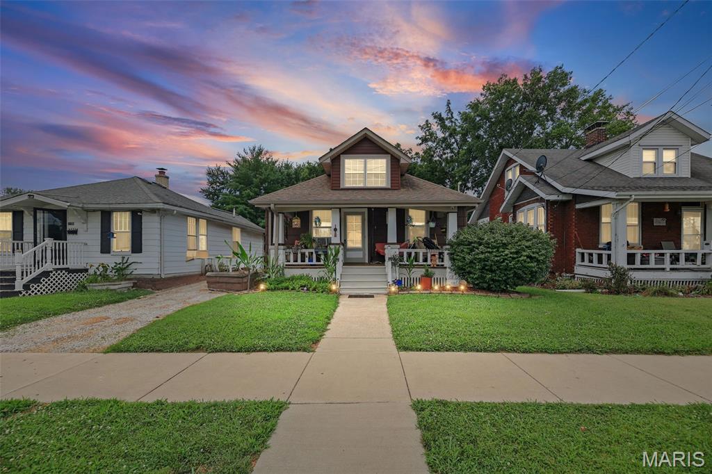 Welcome to 1102 Raab, a charming one-story home with great curb appeal, tall ceilings, original woodwork, and a functional layout. The covered front porch offers a welcoming first impression, while the main level features a spacious living room, dining area, three bedrooms, and a full hall bath with built-in linen storage. The eat-in kitchen includes a gas stove and convenient access to the backyard. The unfinished basement provides laundry space, storage, and potential for future finished square footage. A large attic also offers additional possibilities. Outside, enjoy a brick paver walkway and patio leading to the detached garage/shed with electric. Located near the school, playground, and guest parking, this home offers comfort, character, and opportunity in a convenient setting.