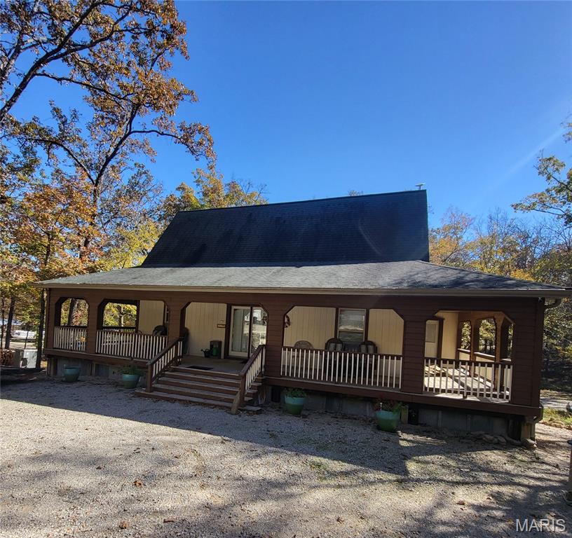 Turnkey investment near Lake Wappapello! This fully leased 39-site RV park includes a rustic lodge-style home, two 1-bedroom rental cabins, and an 8-stall boat storage garage (50'x28'). The RV park generates stable income from year-long leases; tenants pay their own electricity costs. The lodge features vaulted ceilings, a stone fireplace, and a walk-out level clubhouse with a kitchen, coin laundry, lounge, and two full baths. Two bedrooms offer private-porch access and en-suite baths for nightly rentals; a lofted third bedroom adds flexibility. Set in a quiet, wooded neighborhood, the park offers a peaceful atmosphere and a strong sense of community. Whether you're seeking a lake-area retreat, hospitality venture, or multi-use property with reliable revenue, this one blends natural beauty with business potential.