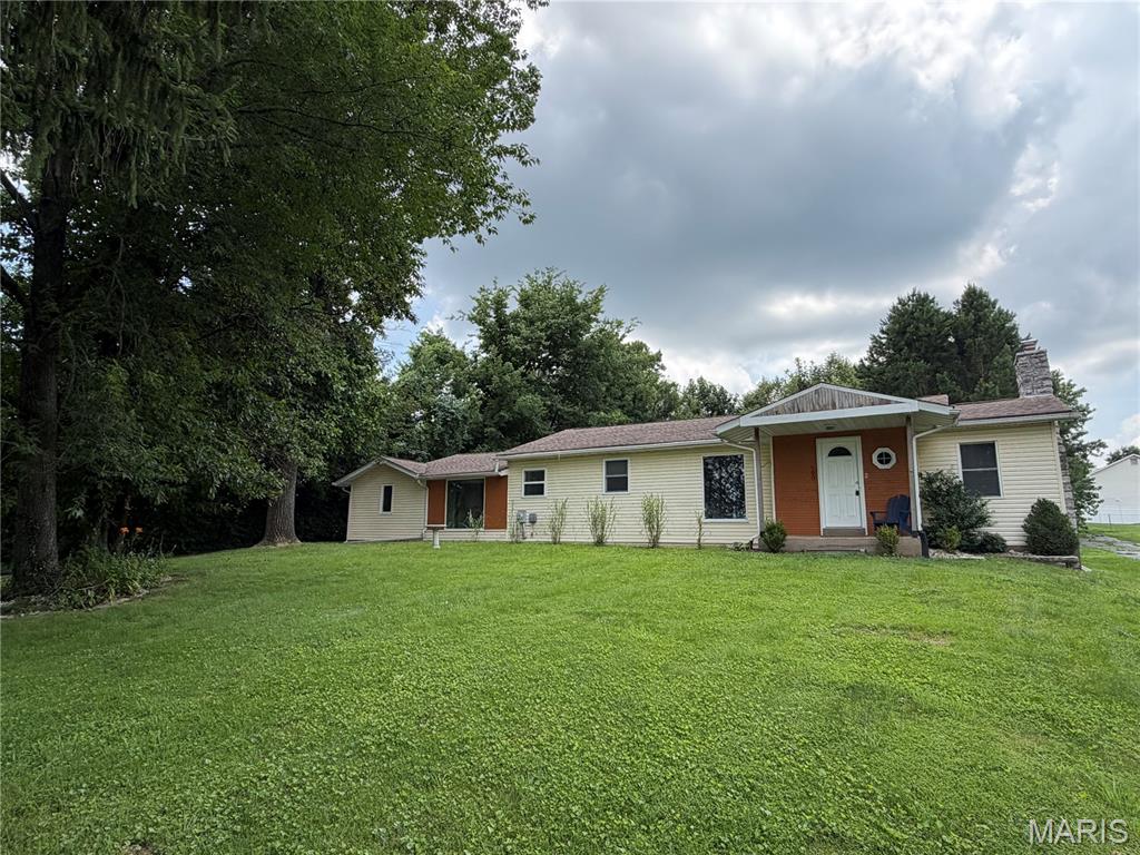 FOR LEASE.  Charming 2 bed/1 bath ranch style home situated on a large beautiful lot in the heart of Oakville.  Gleaming hardwood floors line the majority of the main level of the home.  The living room has a wood burning fireplace as the focal point with built-ins on either side.  The kitchen offers ample storage and plenty of countertop space.  There is a breakfast room and also a separate dining room.  Both bedrooms are spacious and offer walk-in closets.  The unfinished basement comes with your own private washer and dryer and offers a ton of additional storage space.  The covered patio overlooks the large/private backyard.  For those who love a peaceful outdoor space to entertain or just sit and relax, this is it!  Great location, close to just about everything you would need (shopping, entertainment, restaurants, highways, etc.).  Come take a look!