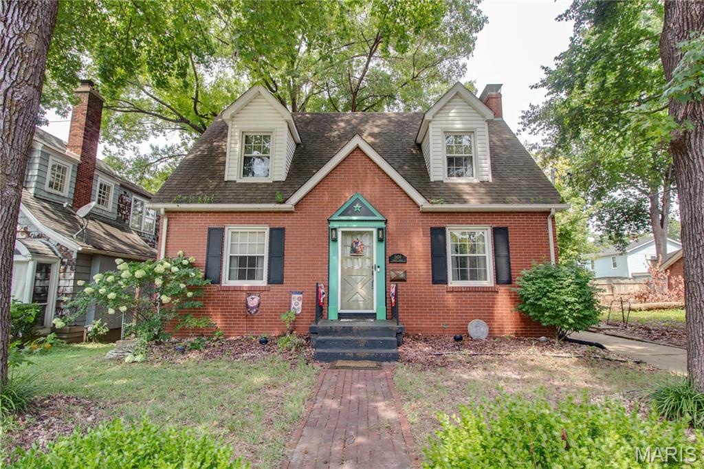 Open House Saturday April 11th from 12:00-1:30. Charming and well-maintained, this 3-bedroom, 2-bath brick home offers a warm and inviting feel both inside and out. Featuring classic brick construction and a concrete driveway, the property includes a detached 1-car garage and a fully fenced backyard with a brick patio and covered deck—perfect for outdoor entertaining or relaxing. Inside, you’ll find hardwood floors throughout the main and upper levels, a cozy gas fireplace in the living room, and a formal dining area. The kitchen includes stainless steel appliances—refrigerator, electric stove and new dishwasher—and opens to a convenient mudroom and sunroom for extra space. Upstairs features three bedrooms and a full bath, with built-in storage and attic access in the hallway. The finished lower level adds a spacious family room with a built-in desk, laundry/utility room, and updated mechanicals, including a new gas water heater, breaker box, and whole-home surge protector.