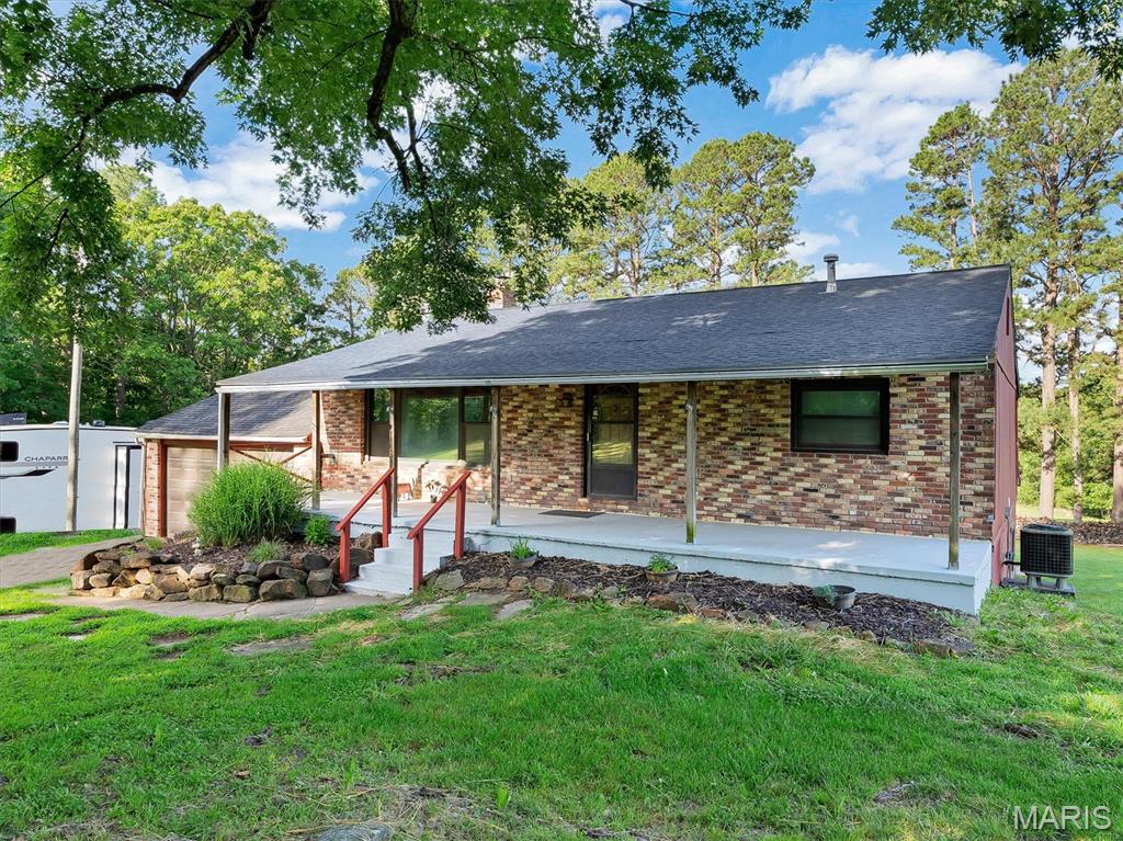 Equestrian Lifestyle - Nestled in complete privacy and surrounded by natural views, this quaint 3-bedroom, 2-bath home offers an exceptional opportunity for horse lovers seeking peaceful rural living with room to ride (horse trails throughout the acreage), roam, and relax. Set on 20.5+/- BEAUTIFUL ACRES with approximately 5-6 acres of pasture (approximately 15 acres of the property is fenced with 5-strand barbed wire for horses or livestock), the property combines functional equestrian potential with the kind of quiet, scenic setting that is increasingly hard to find. The incredible views from the covered back porch overlook rolling pasture and trees, creating the perfect backdrop for morning coffee, evening sunsets, or simply watching your horses graze in total serenity. This property sees 3-15 Deer nightly and 3 Turkey Hens seasonally. With an attached 2-car garage, a 30x50 barn, an insulated 16x25 workshop, and ample open space, the property is well-suited for hobby farming, horses, recreational riding, or creating your own private homestead retreat. Inside, this quaint home offers comfortable living spaces, just waiting for you to make it your own.  There is a wood-burning fireplace in the partially finished walk-out basement, and a pellet stove on the main level for cozy evenings after a day outdoors. The basement offers a bedroom and a bathroom, and provides flexible additional space for a tack room, hobby area, home office, recreation room, or extra storage. Major home improvements have already been completed for peace of mind, including a water heater 1-2 years ago, a new roof 3 years ago, a new Well and an HVAC system 5 years ago, and an updated electric panel 8 years ago.  Whether you’re looking for a private equestrian property, a small farm, or simply a peaceful place to call home, this beautiful property offers the space, privacy, and views to make it truly special.