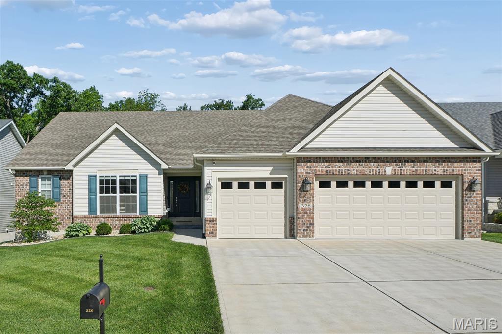 This beautifully maintained ranch home with 3-car garage, impressive curb appeal, and a stunning screened porch is the one you have been waiting for! The stage is set in this popular Brookfield floor plan. Step inside to a dramatic foyer with soaring ceilings, stylish luxury vinyl plank flooring, and an elegant iron-spindle staircase leading to the lower level that is ready for your finishing. The open-concept great room impresses with vaulted ceilings, a gas fireplace, recessed lighting, and a wall of windows flooding the space with natural light and gorgeous wooded views. The gourmet kitchen is a showstopper featuring dark cabinetry, stone counters, tile backsplash, stainless appliances, and a large island with seating for casual dining. A separate formal dining room and eat-in kitchen area offer flexibility for every occasion. The generous primary suite includes plenty of space with wooded views, and a luxurious bath with dual vanities, jacuzzi tub and separate shower. Additional bedrooms, a full bath, half bath, and a well-appointed main-floor laundry with sink and cabinetry complete the package. Step outside to the incredible screened in porch with vaulted ceiling overlooking a deep, private, tree-lined backyard with lower patio. Too much to list - come see it for yourself!