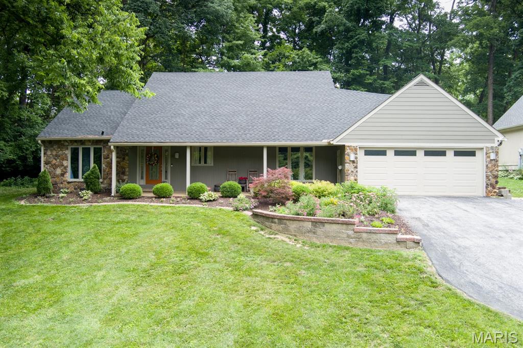 Tucked into a beautiful, established neighborhood surrounded by mature trees, this one-of-a-kind home offers over 4,600 square feet of living space with room for everyone. From the moment you arrive, you'll appreciate the exceptional curb appeal, inviting front porch, and the character that sets this home apart from the rest.Inside, you'll find 3 spacious bedrooms, 4 bathrooms, and multiple living areas designed for both everyday living and entertaining. The main level features a welcoming living room, a comfortable family room, and an abundance of space to gather with family and friends. The fully finished lower level expands your living options even further with a large recreation room and endless possibilities for a home theater, game room, fitness area, or additional entertaining space.The outdoor living is just as impressive. Step outside to a stunning private patio retreat complete with extensive hardscaping, a built-in fire pit, seating area, and plenty of room for outdoor dining and entertaining. The beautifully landscaped yard and wooded backdrop create a peaceful setting you'll enjoy year-round. If you've been searching for a home with character, generous room sizes, multiple living spaces, and an incredible outdoor setting, this is one you won't want to miss. A rare opportunity to own a home that perfectly blends charm, comfort, and functionality in a highly desirable neighborhood.  Has passed City Occupancy.