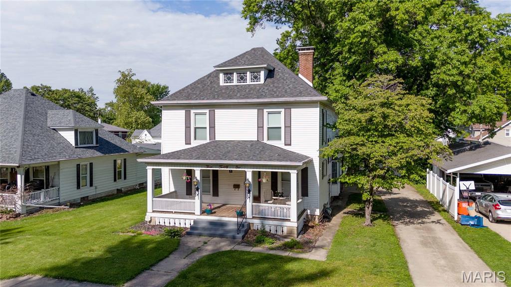 Searching for the perfect home for your growing family? This could be the one you’ve been waiting for! Full of character and charm, this home is truly something you need to experience in person to fully appreciate. Original hardwood floors, beautiful wood doors, detailed trim work, and timeless craftsmanship give this home warmth and personality throughout. Designed with both everyday living and entertaining in mind, the home features two spacious family rooms along with a large open kitchen and dining area that creates the perfect gathering space for family and friends. The oversized mudroom and pantry provide exceptional main-level storage and functionality. Upstairs, you’ll find three generously sized bedrooms along with the conveniently located laundry room. The spacious bathroom is sure to impress with its relaxing soaking tub and separate shower. Need even more space? The attic offers excellent potential for a cozy reading nook, hobby area, or additional storage. Step outside and enjoy summer evenings on the backyard patio, perfect for grilling, entertaining, or simply unwinding after a long day. The impressive 3-car garage offers alley and street access, giving you plenty of room for vehicles, tools, toys, or even a workshop setup. Homes with this much character, space, and functionality do not come along often. Schedule your personal showing today and come see everything this incredible home has to offer!