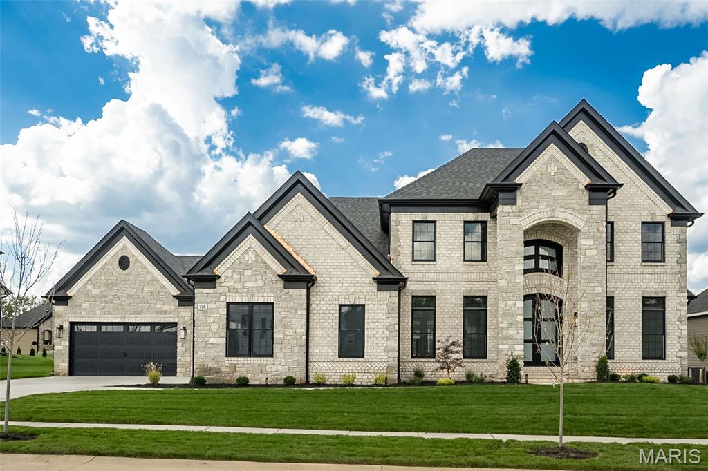 New Construction, Chesterfield, Rockwood Schools! MAGNIFICENT 1.5 Story home w/ Finished Lower Level in a FABULOUS LOCATION! Crafted by St. Louis' premier hands-on builder, Claymont Development, LLC - Wesley Byrne. The WINGATE III is a spectacular 5BR, 4.5bath w/ 5200 sqft of exquisitely finished living space. Exterior features a warm blend of brick & stone; extensive millwork; The two-story entry foyer makes a striking first impression! Formal dining room w/ wainscoting & office on either side of the Foyer; two-story great room w/ gas fireplace, built-in shelving. Gourmet kitchen features custom cabs, granite counters & 9-ft island! Luxury owner’s suite w/ dual closets. Three bedrooms, two baths, & bonus room complete the upper level. 10' main floor ceiling, 8' doors, 4-car garage! Sensational LL includes brick/stone wet bar, huge rec-room, 5th bed & full bath. Tour is of the Display Home.