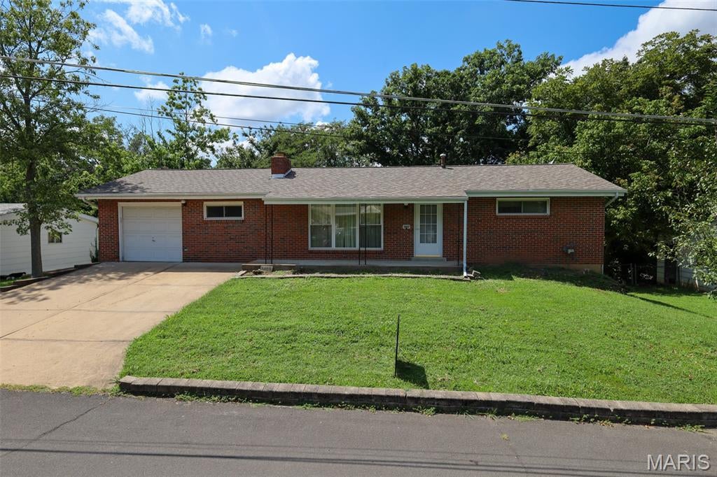 This 3-bedroom, 2-bath home offers a functional layout with additional living space in the partially finished walkout lower level. The lower level provides plenty of flexibility for a family room, home office, recreation area, or additional storage.

Outside, enjoy a fenced backyard with plenty of room for entertaining. Conveniently located near the St. Louis County line, this home provides easy access to shopping, dining, major roadways, and surrounding communities.

With three bedrooms, additional finished lower-level space, a walkout basement, and a fenced yard, this home offers plenty of functionality. Property to be sold As-Is.