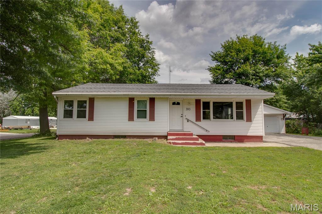 This cozy, ranch style home sits on a corner lot with lots of outside space and an expansive yard with an additional storage shed. The owner has spared no expense in rejuvenating the living area, with new LVP flooring, fresh paint throughout, new windows and interior doors and hardware. The roof was replaced in 2025; a complete bath remodel; the 50 gallon water heater was installed in 2021.  A 2-car detached garage is heated and large enough for your vehicles and a workshop area.  A full basement, although not finished has been divided into smaller rooms, one of which contains the laundry and a shower.  A larger room would be ideal for entertaining or just a fun game room.  Check out this home in a quiet residential neighborhood.  It's conveniently located just a few short blocks from several town conveniences. Contact your favorite agent and see this home.