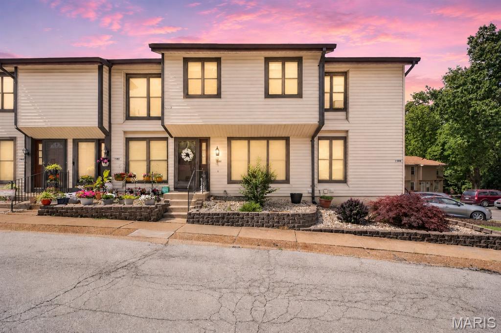 Welcome home to this spacious 2-story townhouse-style condo featuring beautiful hardwood floors throughout the main level. The upper level offers 3 generously sized bedrooms, including a primary suite with a private full bath, plus an additional full bathroom for added convenience. With 4 bathrooms total, there's plenty of space for everyone.
The kitchen is equipped with stainless steel appliances, including a stove and dishwasher, and opens to the main living areas for easy everyday living and entertaining. The finished walk-out lower level boasts a large family room and leads to a private, newly poured concrete patio, perfect for relaxing outdoors. Residents enjoy access to the neighboring Hilltop Pool and clubhouse, providing excellent amenities just steps from your door.