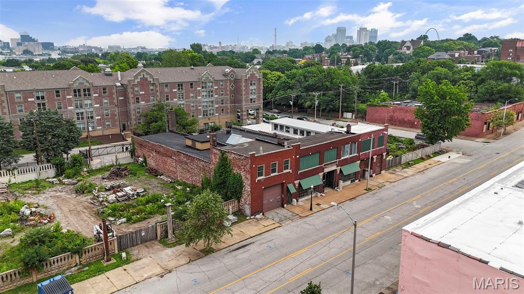 Prime Lafayette Ave Opportunity being sold as a package or individual lots | 13,490 SF architectural Gem + 8 Vacant Lots Welcome to 2701-2729 Lafayette —an architecturally striking 13,490 square foot building bursting with potential in one of St. Louis’ most vibrant, walkable neighborhoods. Just one block from Lafayette Square, this stunning structure sits at the heart of a rare, multi-lot offering that includes five vacant lots on one side and three on the other. With its soaring ceilings, ornate detailing, and grand presence, the space is a dream canvas for visionary developers, entrepreneurs, and hospitality professionals. Imagine an upscale event venue, boutique hotel, wedding hall, or restaurant and patio concept, with ample room to incorporate on-site parking and lush outdoor entertaining areas, thanks to the adjacent lots. Alternatively, the footprint and location are ideal for residential development—whether luxury townhomes, single-family residences, or a boutique apartment conversion. The building’s interior features stunning original elements that can be creatively repurposed or restored, offering character you simply can’t recreate. Zoned for flexibility and surrounded by sought-after architecture, local amenities, and booming development, this property presents a one-of-a-kind opportunity to make a lasting mark in the heart of St. Louis.