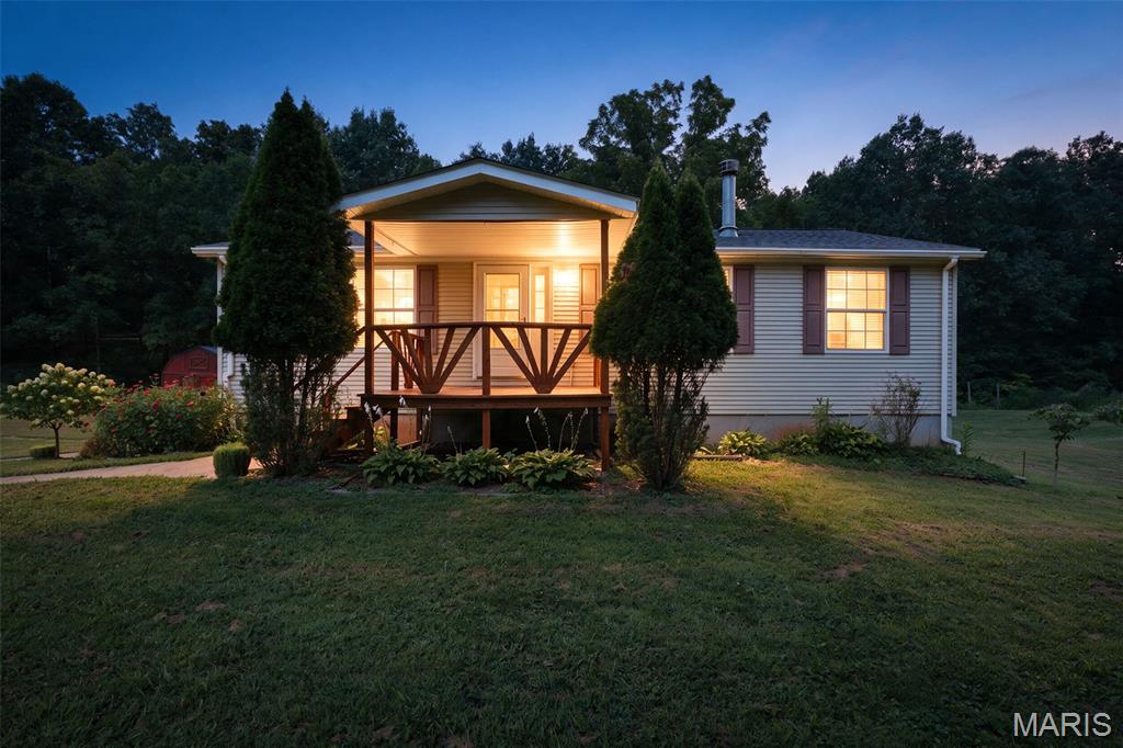Look at this amazing opportunity to acquire a beautifully taken care of 3-bedroom 2 bathroom Manufactured home permanently affixed to a full walk out foundation situated perfectly on 20m/l unrestricted acres. Home has been meticulously kept and updated with a few of the updates including new HVAC system and Flooring in 2022, and new roof and skylights in 2025. There are several trails leading through the wooded acreage filled with abundant wildlife featuring wet weather waterfalls, a shooting range, small pond, and amazing overwatch positions that would be perfect for this coming rifle season. And being 20 continuous acres landowner tags can be acquired for the landowner. Ask your agent about the personal property that can be included with the sale and the additional list of improvements the current owners have made. Made sure to check out the photos of the property and weather permitting walk back and see your very own waterfall. This property could be your very own paradise, weekend getaway, hunting camp, or anything else you can think of. Show it while you can because it won't last long.